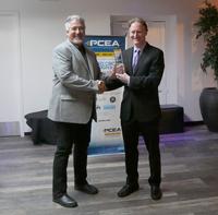 Mike Foster accepts the Accessories Technology NPI award from CA editor Mike Buetow.